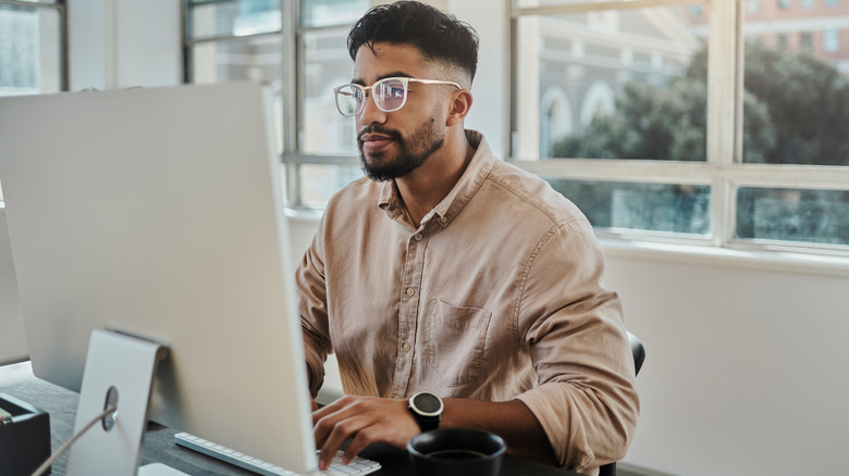 person at desktop computer