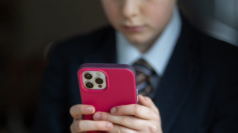 child using an iPhone