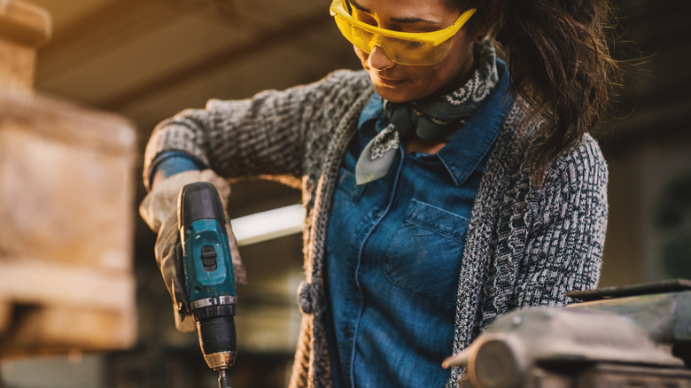 Person using cordless drill