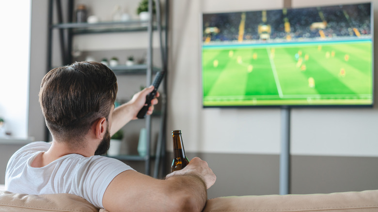 person watching live sports TV