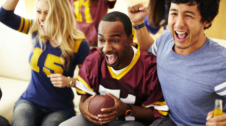 Group of people watching football