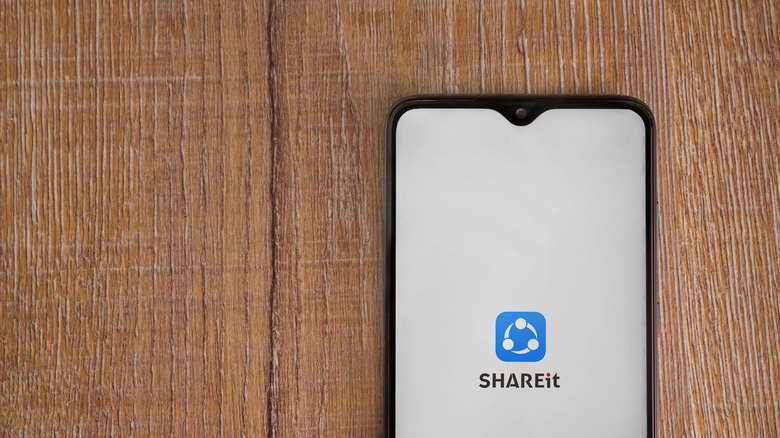 SHAREit logo on phone on table