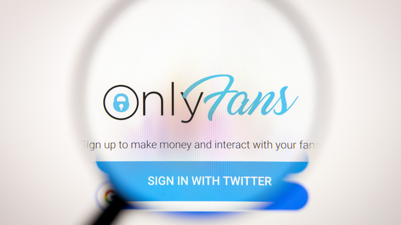 OnlyFans logo under magnifying lens