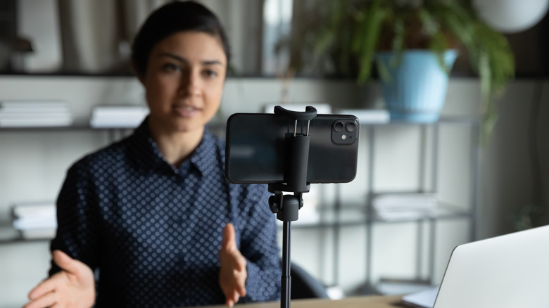 Speaking at smartphone during a video call