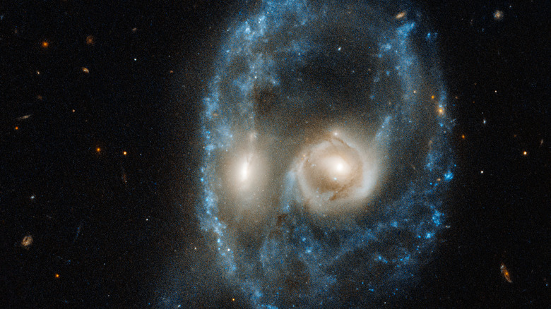 Hubble snap showing galactic merger that looks like a colossal skull.