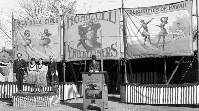 Honolulu Entertainers Show -- two young Hawaiian girls and their musicians performing at a circus show, 1920 photo advertising show.