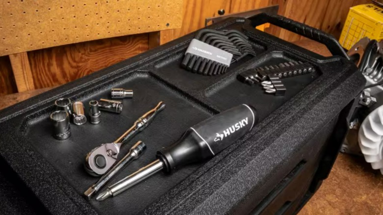 A set of Husky tools on a tool box.