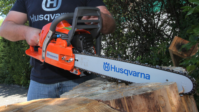 Husqvarna chainsaw cutting wood