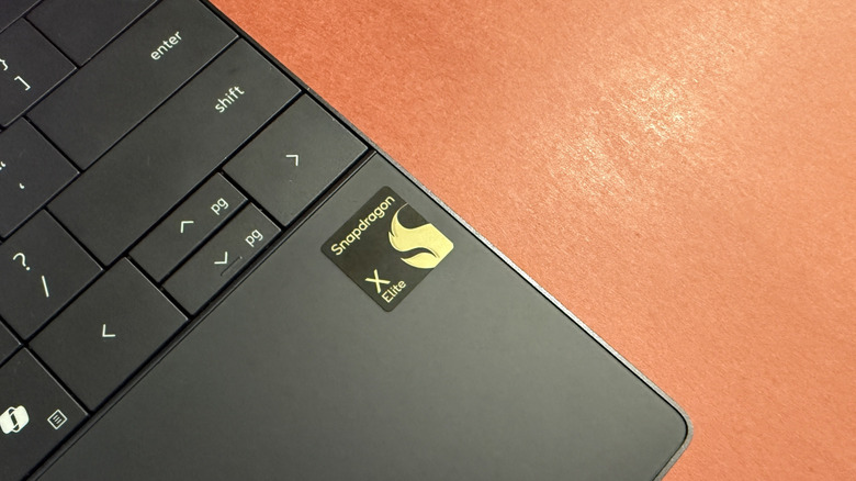 Closeup view of the direction keys and Snapdragon badge on the Dell XPS 13.