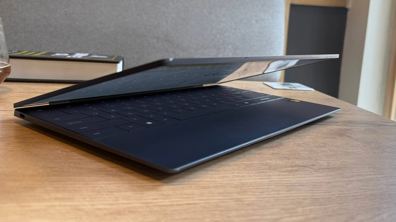 Side profile of the Dell XPS 13 with a semi-open lid.