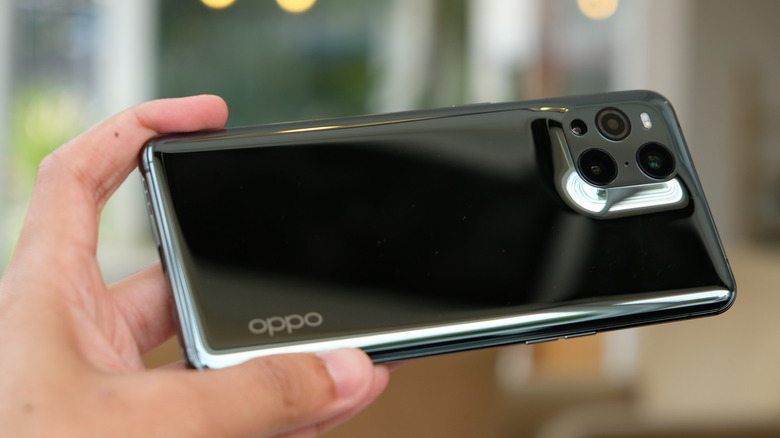 Man holding OPPO smartphone