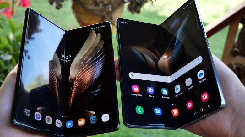 Someone holding Samsung Galaxy Z Fold devices