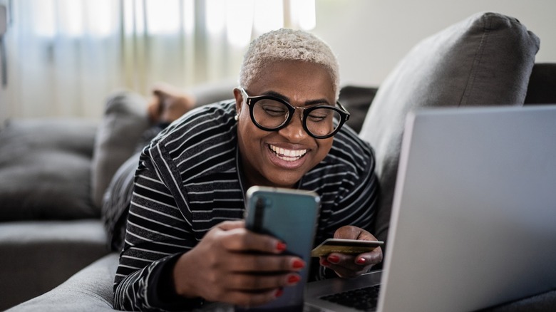 smiling woman using phone