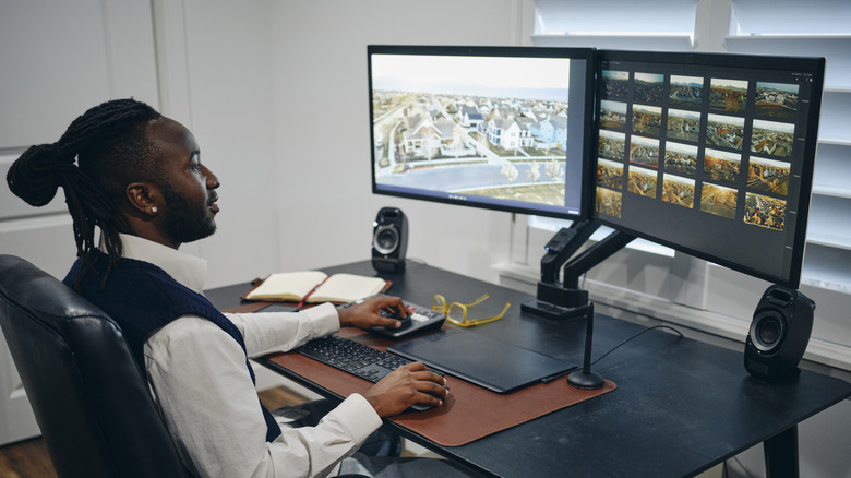 Man sorting through video footage to edit