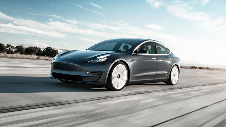 Tesla Model 3 speeding on road