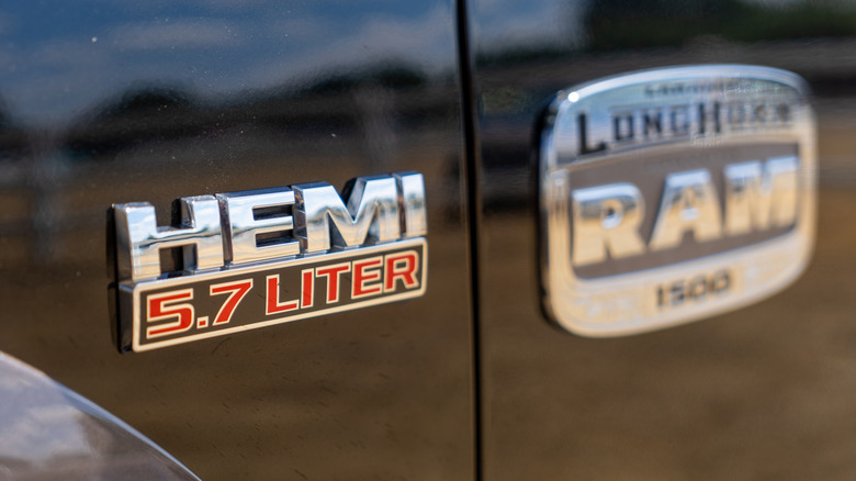 A HEMI V8 badge on a RAM pickup truck