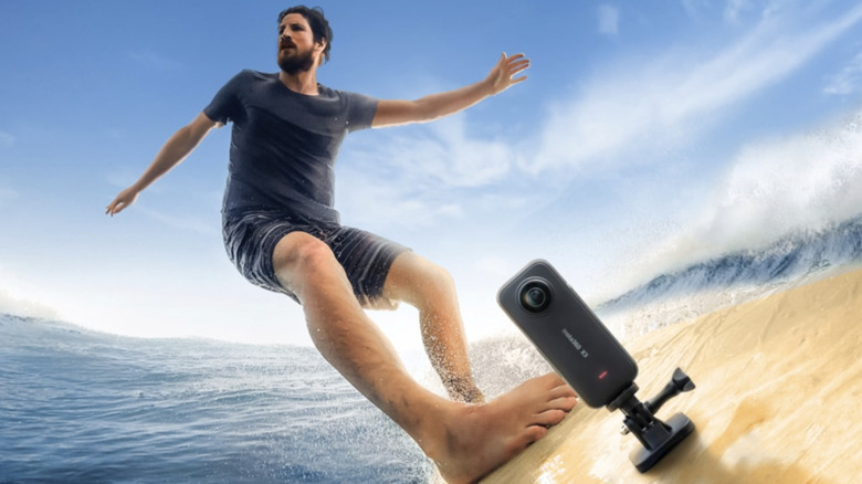 Man on surfboard with Insta360 X3