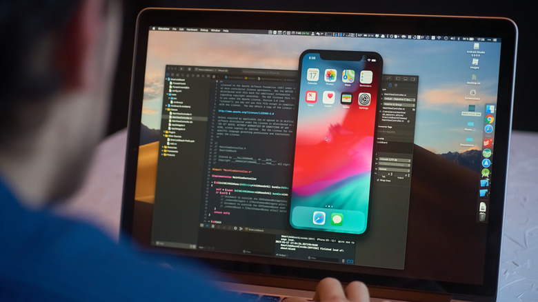 iOS developer on laptop