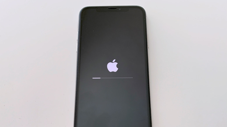 iPhone with Apple logo on screen