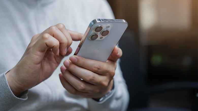 person holding iPhone in their hand