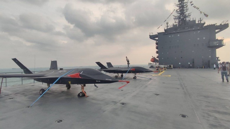 Two Iranian JAS-313 drones atop the flight deck of the Shahid Bagheri aircraft carrier