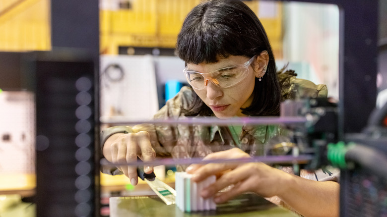 Person using 3D printer