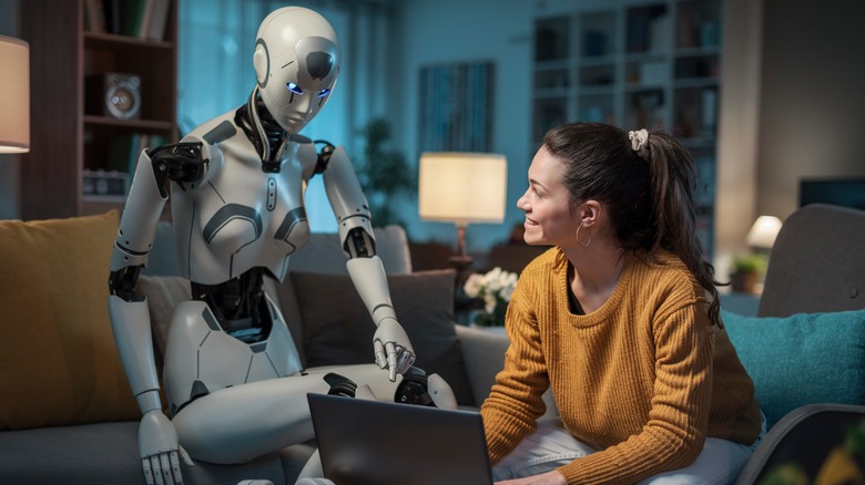 a robot sitting with a human