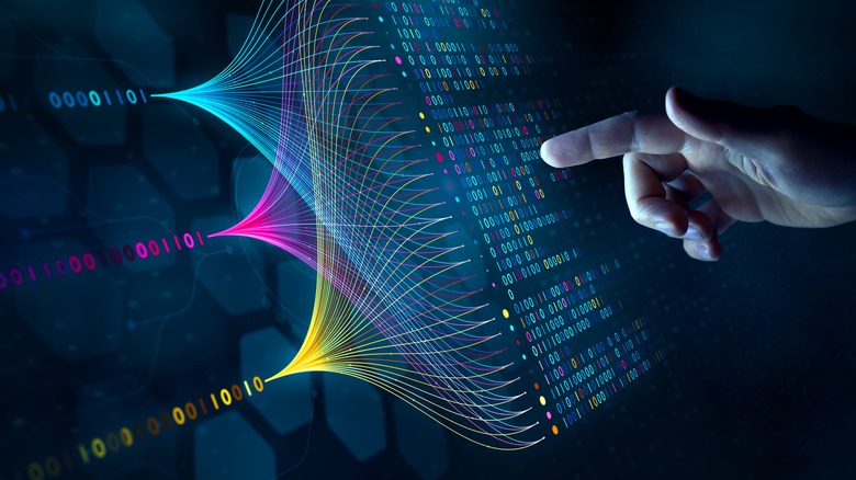 a finger pointing at a representation of data