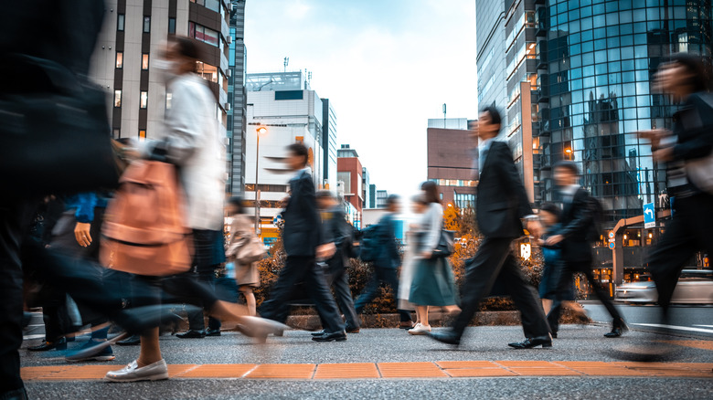 people walking on the sidewalk