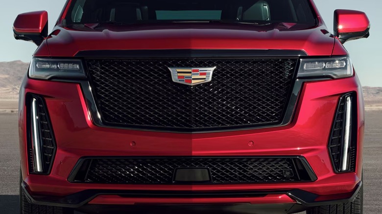 Front grill of a Cadillac with iconic logo in place