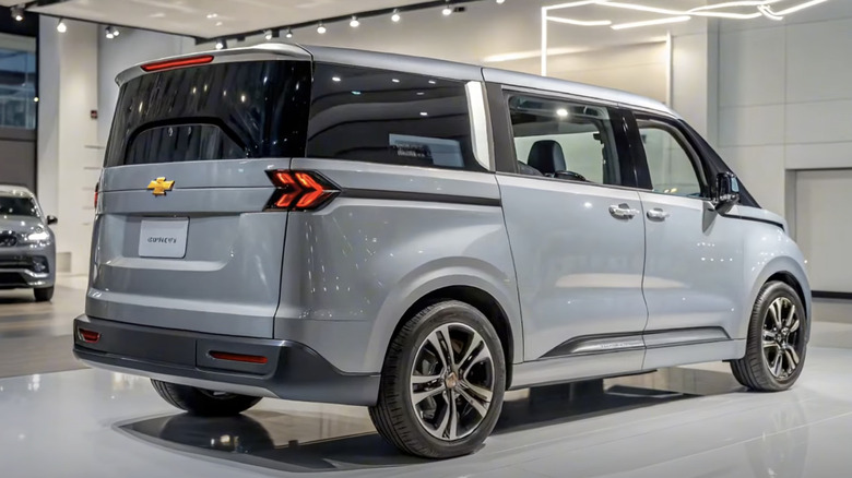 The rear of the rumored Chevrolet Astro Van in silver displayed in a showroom