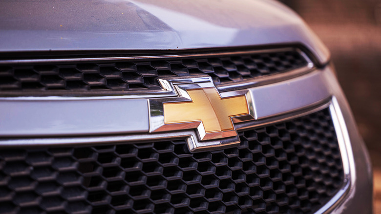 Chevrolet's golden bowtie emblem displayed on the front grille of a car