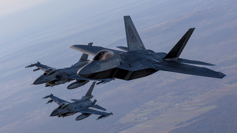 F-22 Raptors flying in formation overhead