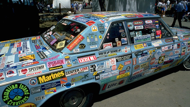 Car covered in bumper stickers.