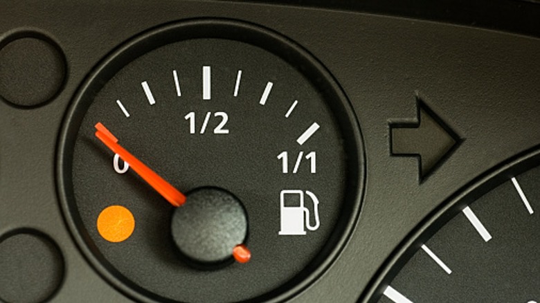 Fuel gauge indicating the gas tank is almost empty.