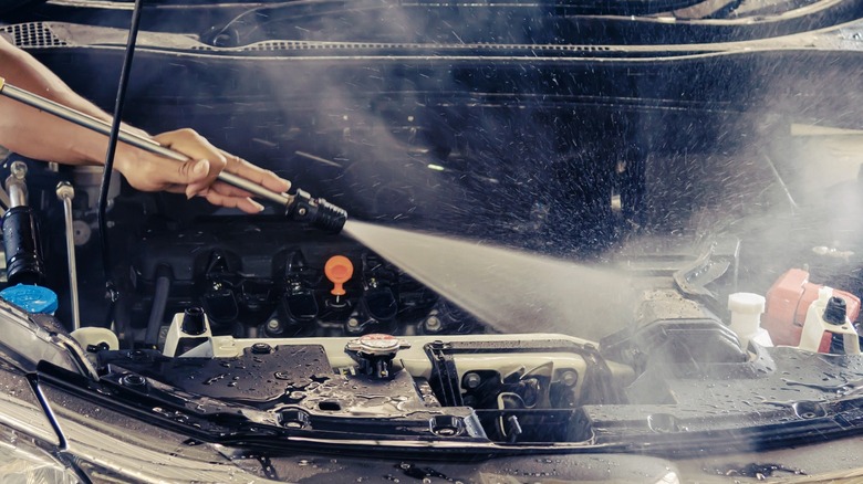 Pressure washing a car's engine