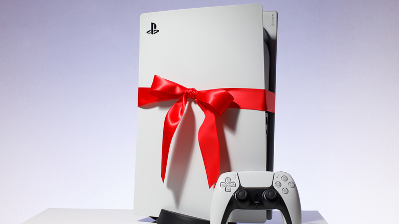 PS5 wrapped with red ribbon