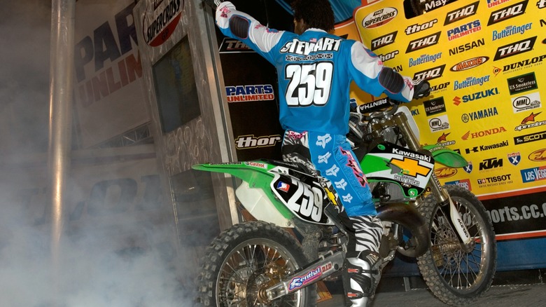 James Stewart celebrating aboard his two-stroke Kawasaki KX125.