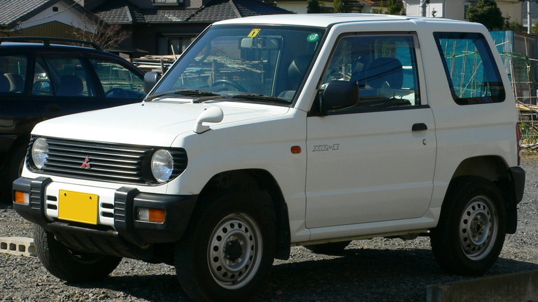 First-generation Mitsubishi Pajero Mini (XR-I) snapped in a gravel parking lot