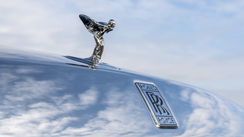 Close up of the Spirit of Ecstasy badge on a Rolls-Royce car