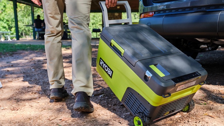 Person pulling Ryobi cooler