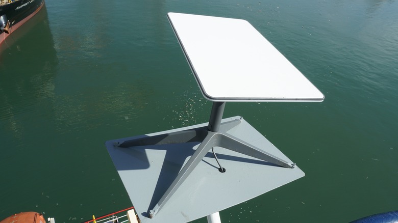 Starlink dish mounted on the wing of a container ship