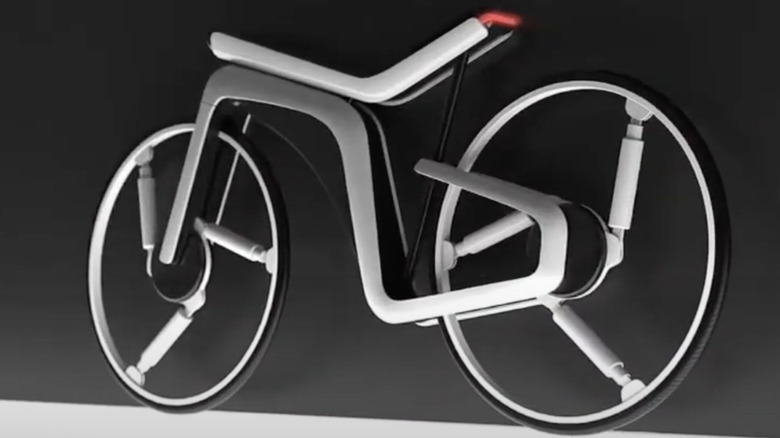 Tesla Model B e-bike concept design against dark grey background