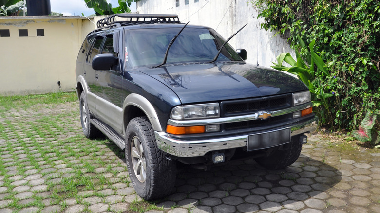 Passenger view of Chevrolet K5 Blazer parked on the street