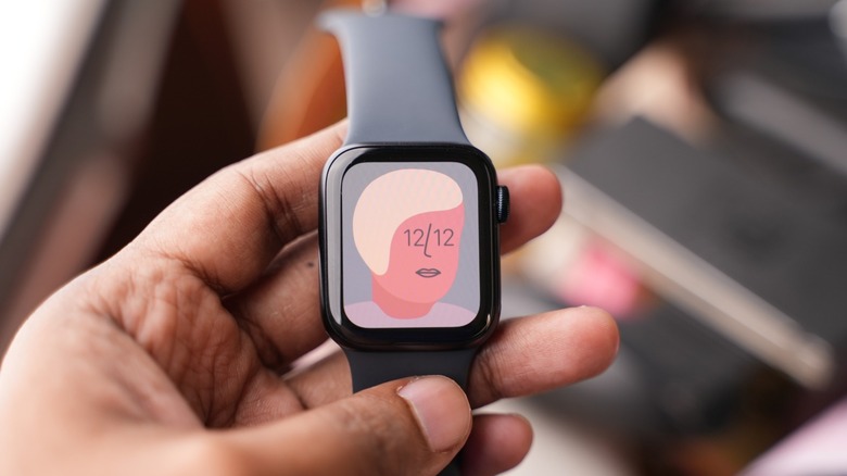 Person holding an Apple Watch SE 2