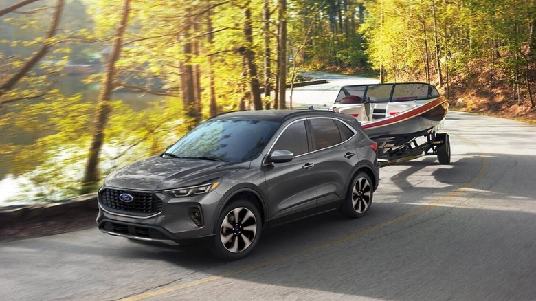 Front angle view of the 2025 Ford Escape towing a trailer