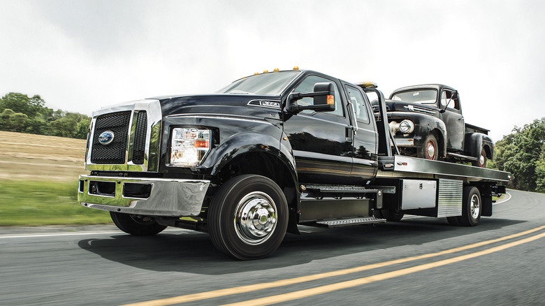 Triton-powered Ford F-650 hauling vintage F-150