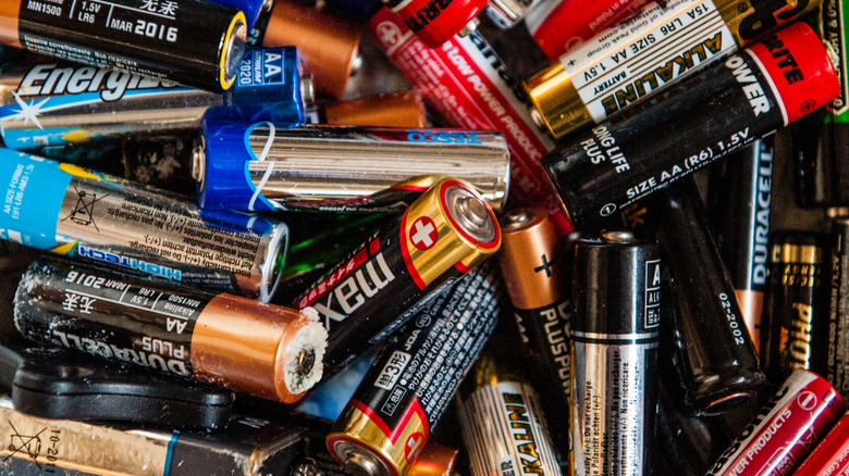 pile of damaged and discarded batteries