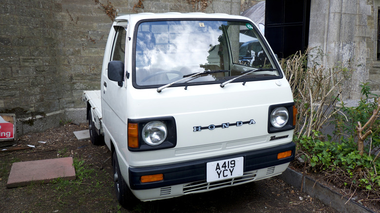 A Honda Acty Kei truck in white color