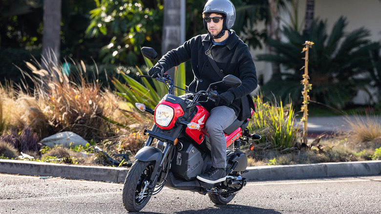 Person riding Honda Navi